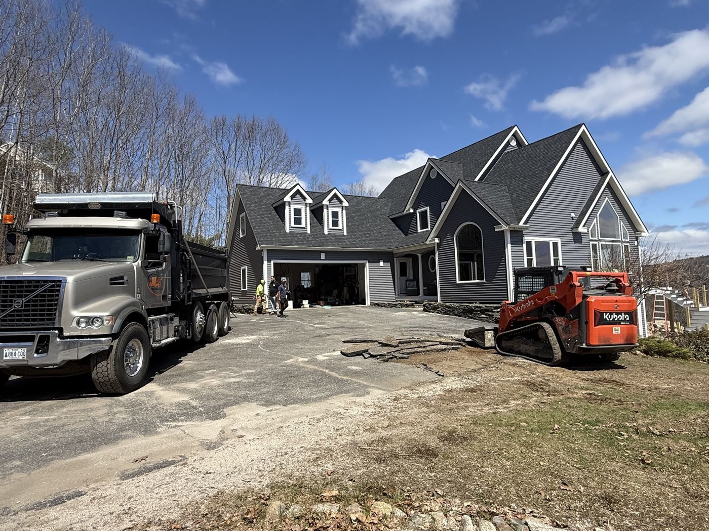 Grading and base preparation with heavy equipment