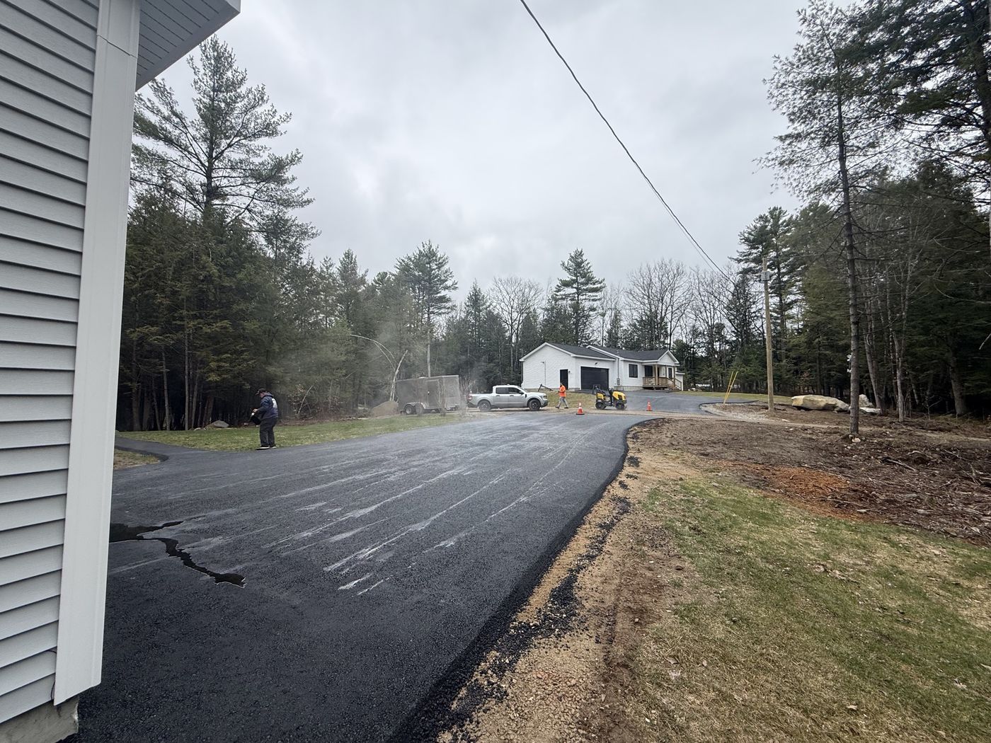 Dark, freshly sealed asphalt surface